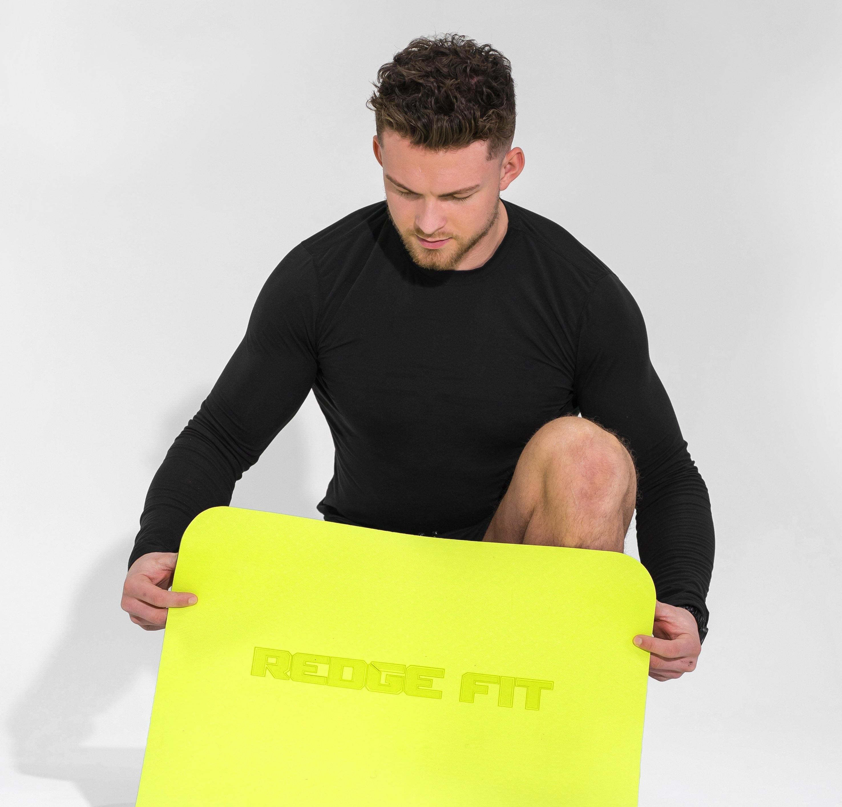 Man modeling the Redge Fit Double Sided Workout Mat Available at https://www.getredge.com/products/redge-double-sided-workout-mat