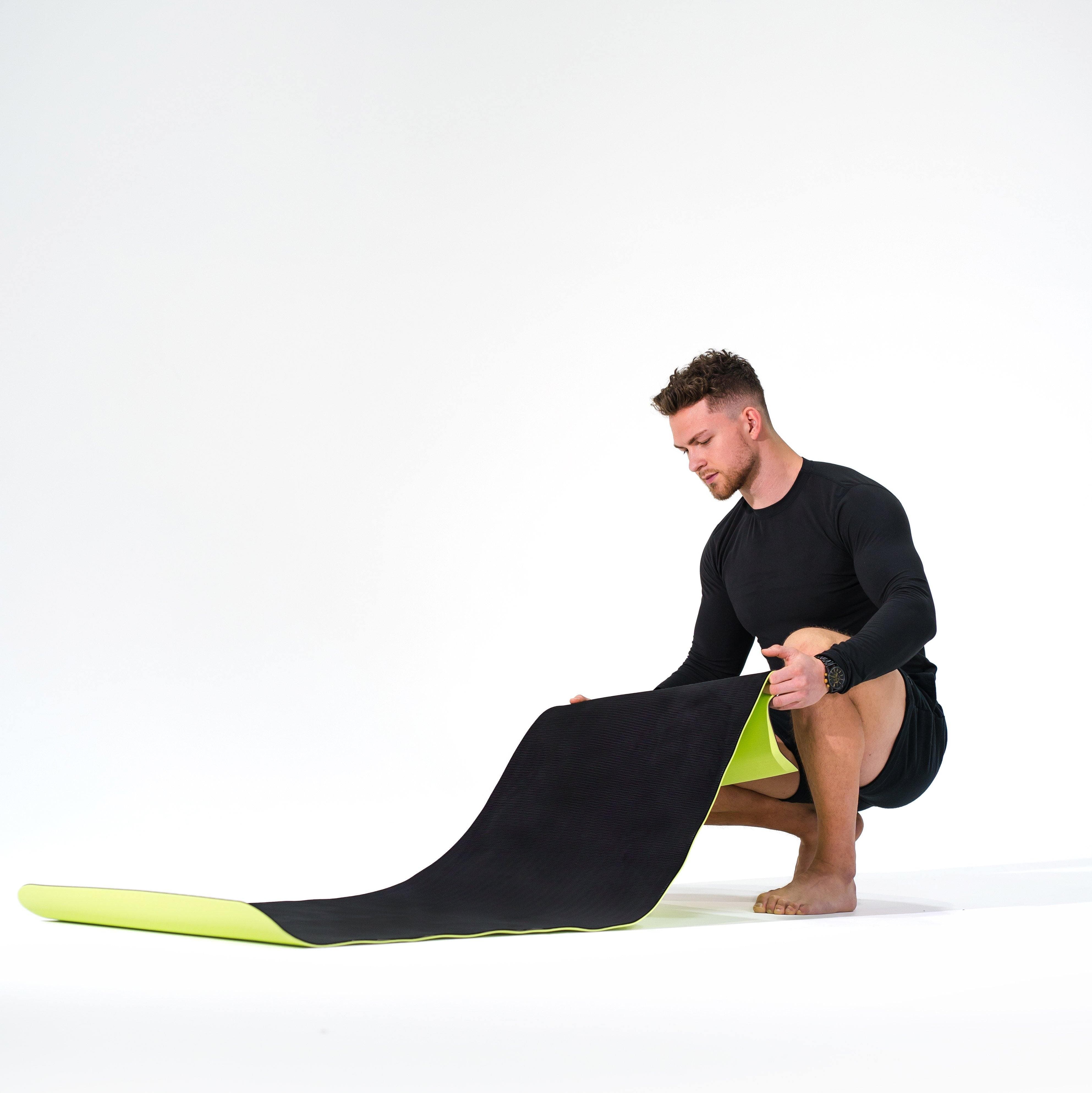 Man modeling the Redge Fit Double Sided Workout Mat Available at https://www.getredge.com/products/redge-double-sided-workout-mat