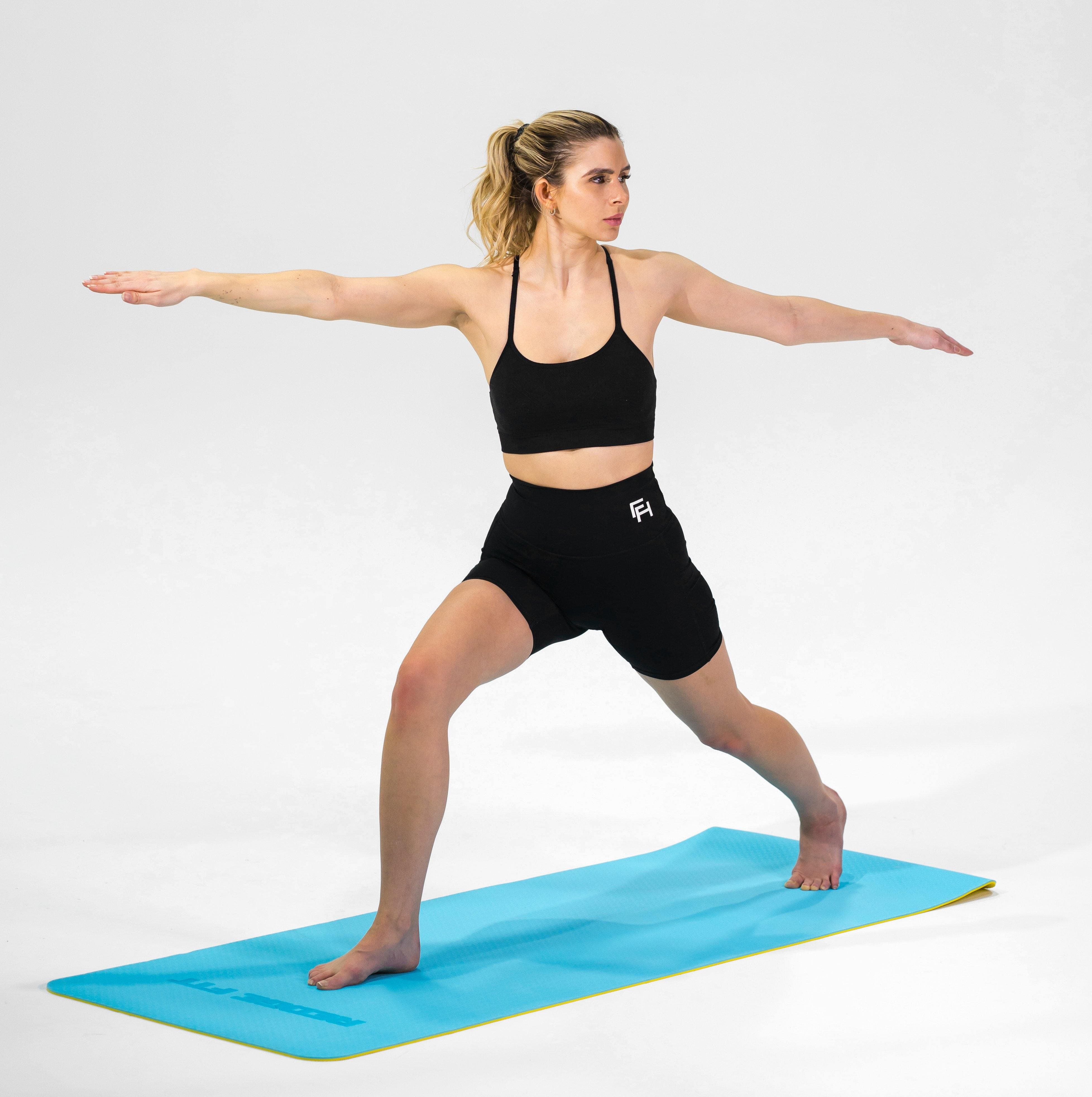 Woman modeling the Redge Fit Core Focus Yoga Mat Available at https://www.getredge.com/products/core-focus-all-in-one-pack