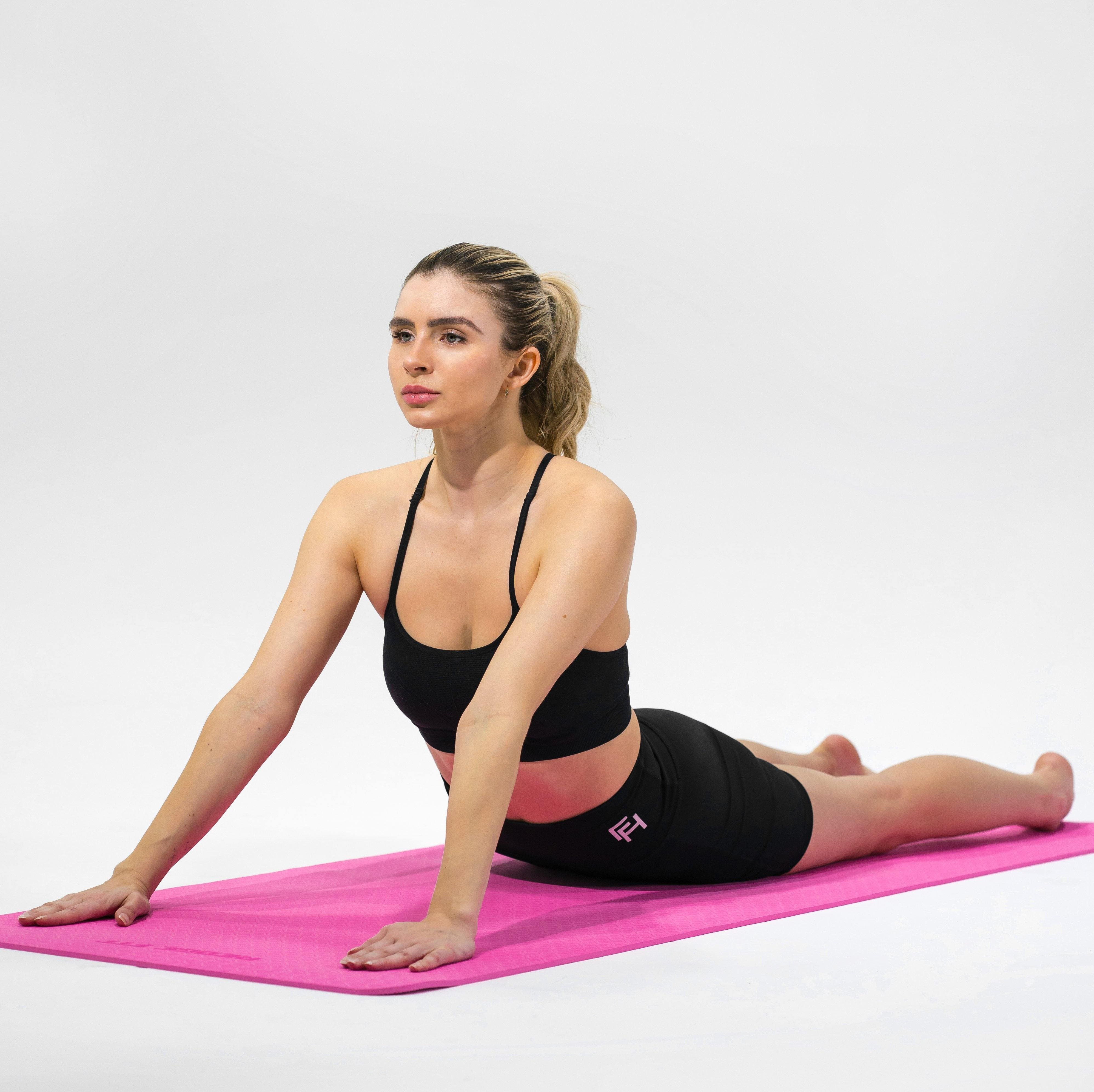 Woman modeling the Redge Fit Double Sided Workout Mat Available at https://www.getredge.com/products/redge-workout-mat