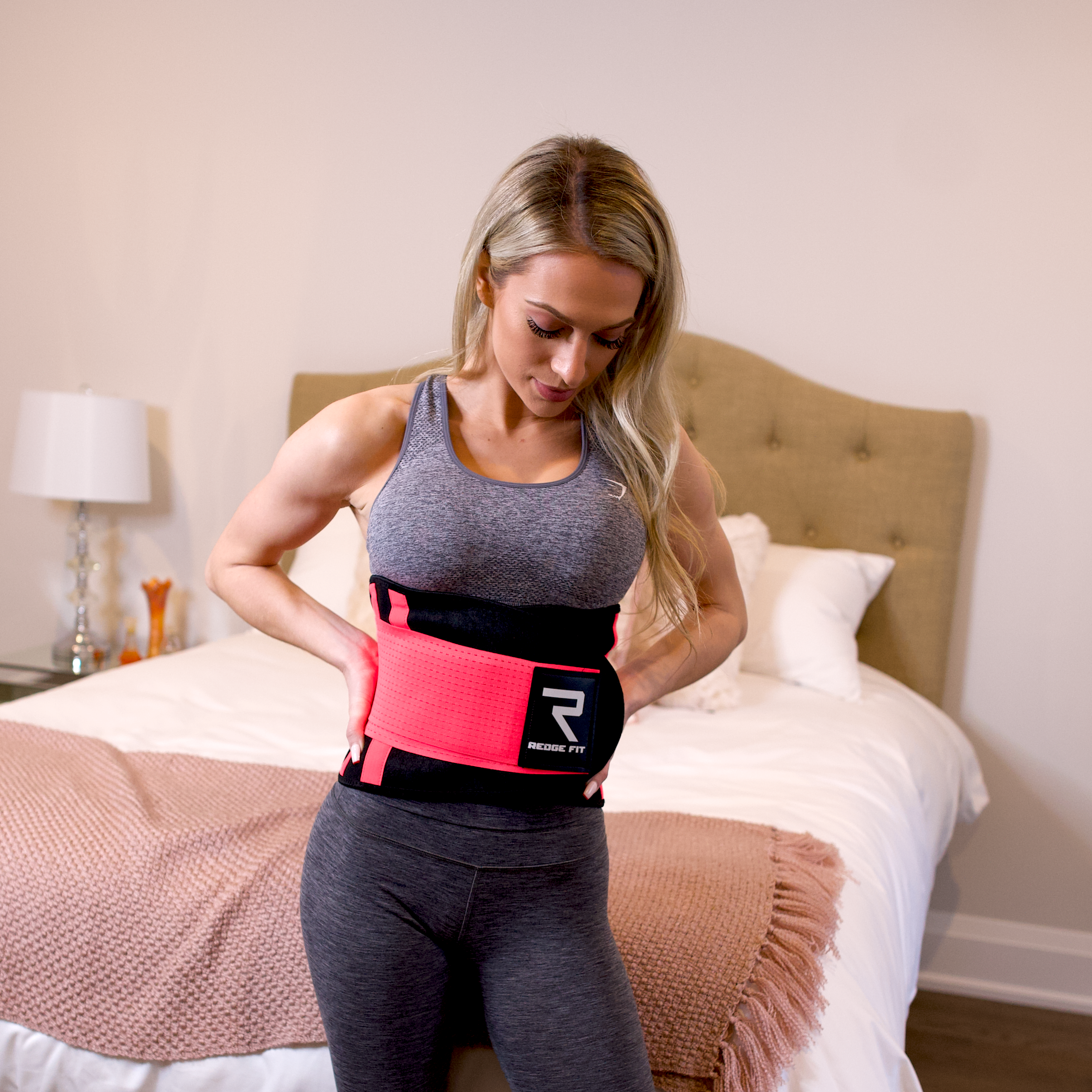 Woman modeling the Redge Fit Waist Shaper Size Chart: Size Waistline (Inches) Width (Inches) XS 31.5 8.8 S 35.5 8.8 M 39.5 8.8 L 43.5 8.8 XL 47 8.8 XXL 51 8.8 Available at https://www.getredge.com/products/redge-waist-shaper-sweat-belt-women