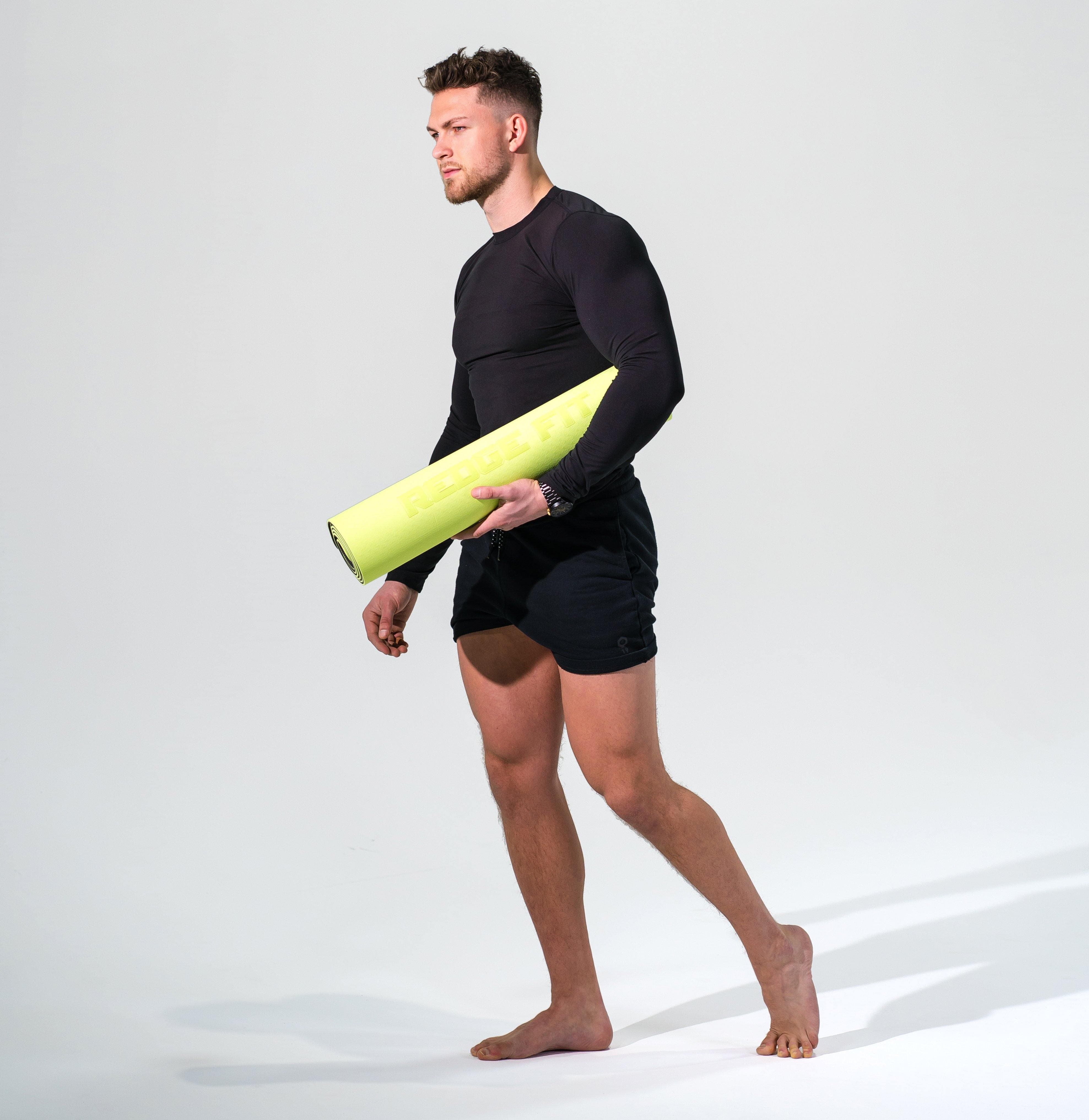 Man modeling the Redge Fit Double Sided Workout Mat Available at https://www.getredge.com/products/redge-double-sided-workout-mat