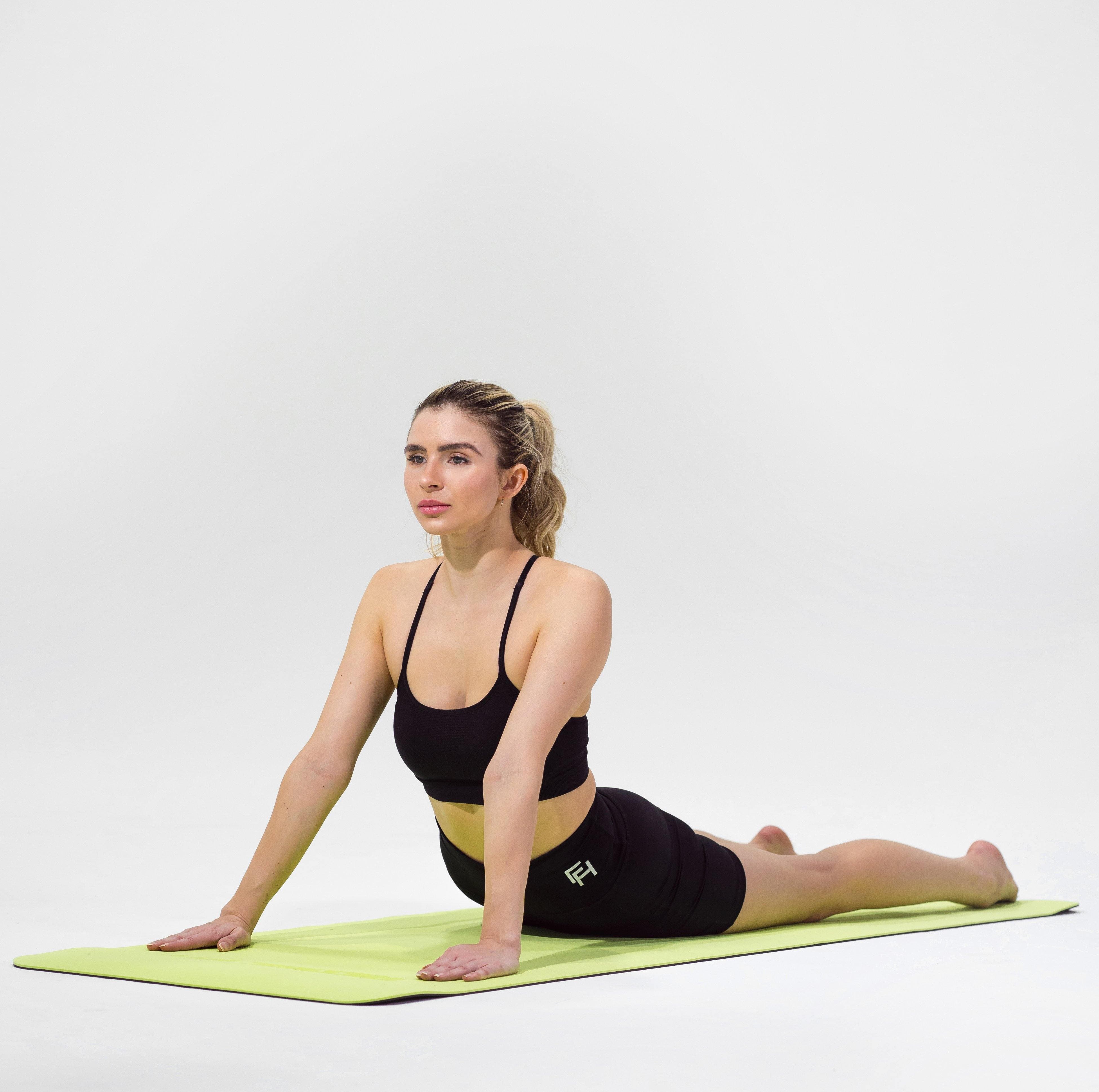 Woman modeling the Redge Fit Double Sided Workout Mat Available at https://www.getredge.com/products/redge-double-sided-workout-mat